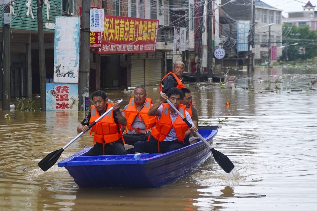 Many Dixi residents had to rely on friends and neighbours with boats to rescue them from their flooded homes. Jiangxi. Photo: Tom Wang
