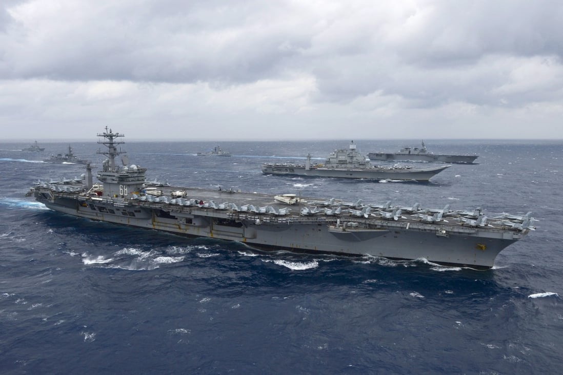 The aircraft carrier USS Nimitz leads a formation of ships from the Indian Navy, Japan Maritime Self-Defence Force and the US Navy in the Bay of Bengal during a naval exercise in 2017. Photo: AFP