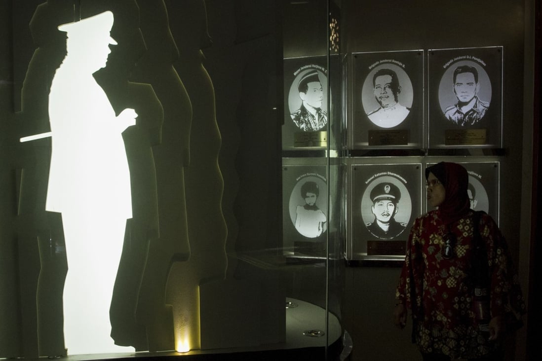 A woman visits a memorial to the Indonesian dictator Suharto in Yogyakarta. Photo: AFP