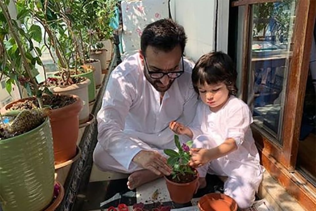 Kareena Kapoor’s Instagram picture of her actor husband Saif and son Taimur gardening together.