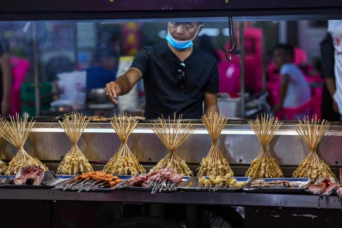 A vendor at Xisi Night Market, in Henan’s Kaifeng city, on June 1. China’s small businesses are a vital engine of economic growth, and they are faltering. Photo: Imaginechina