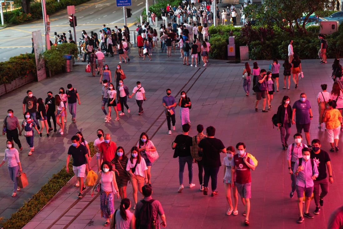 Pedestrians pass along Orchard Road in Singapore. Photo: Bloomberg