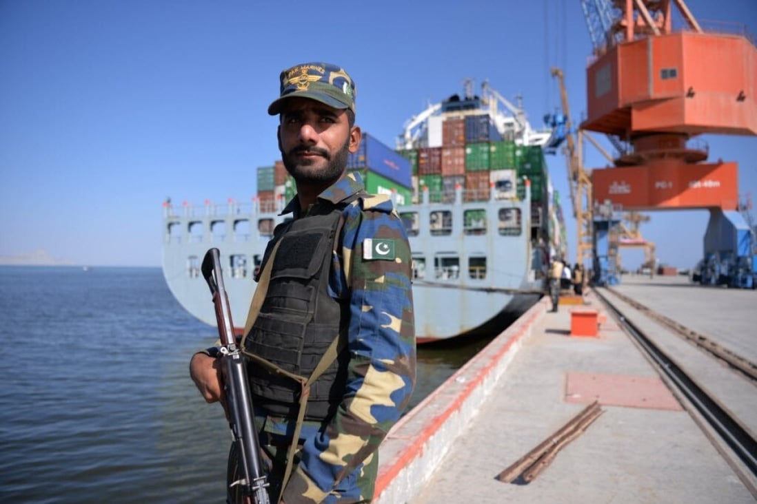 A member of the Pakistani navy guards a ship carrying containers at the Gwadar port in 2016. Photo: AFP