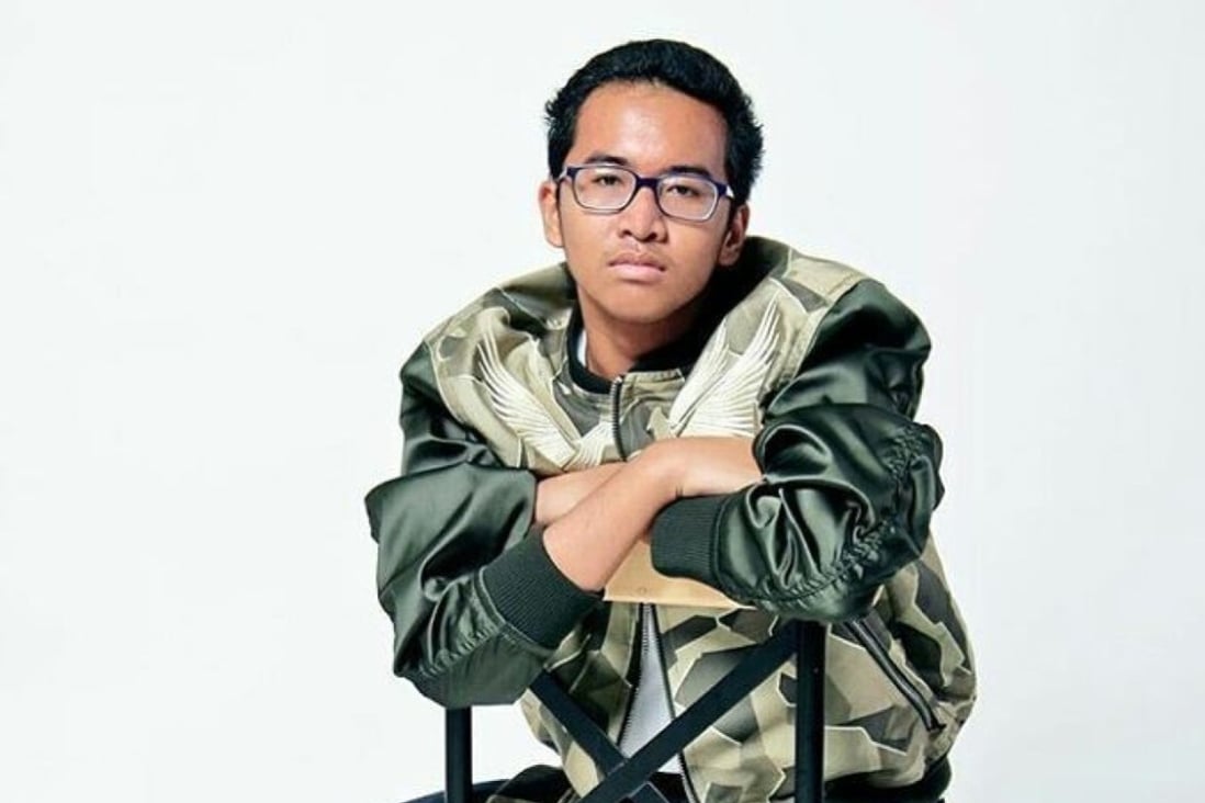 Deaf and mute young Indonesian fashion designer Rafi Ridwan, who held ...