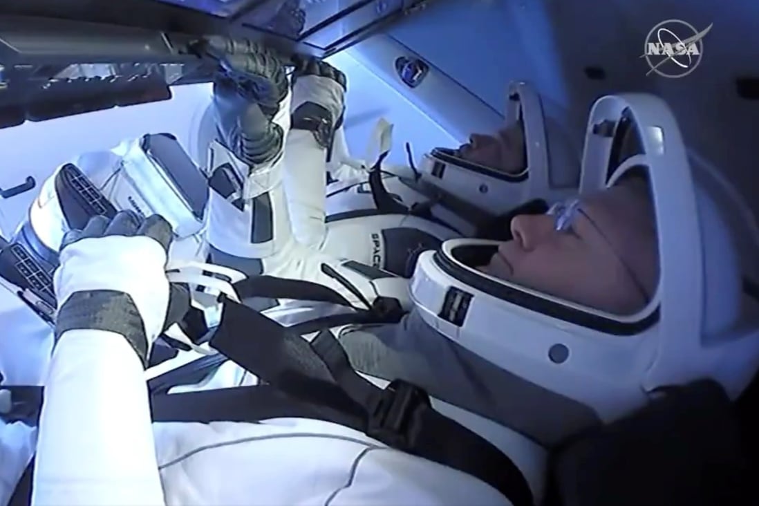 Nasa astronauts Robert Behnken and Douglas Hurley are seen aboard SpaceX’s “Endeavour” spacecraft on Sunday. Photo: Nasa handout via Reuters