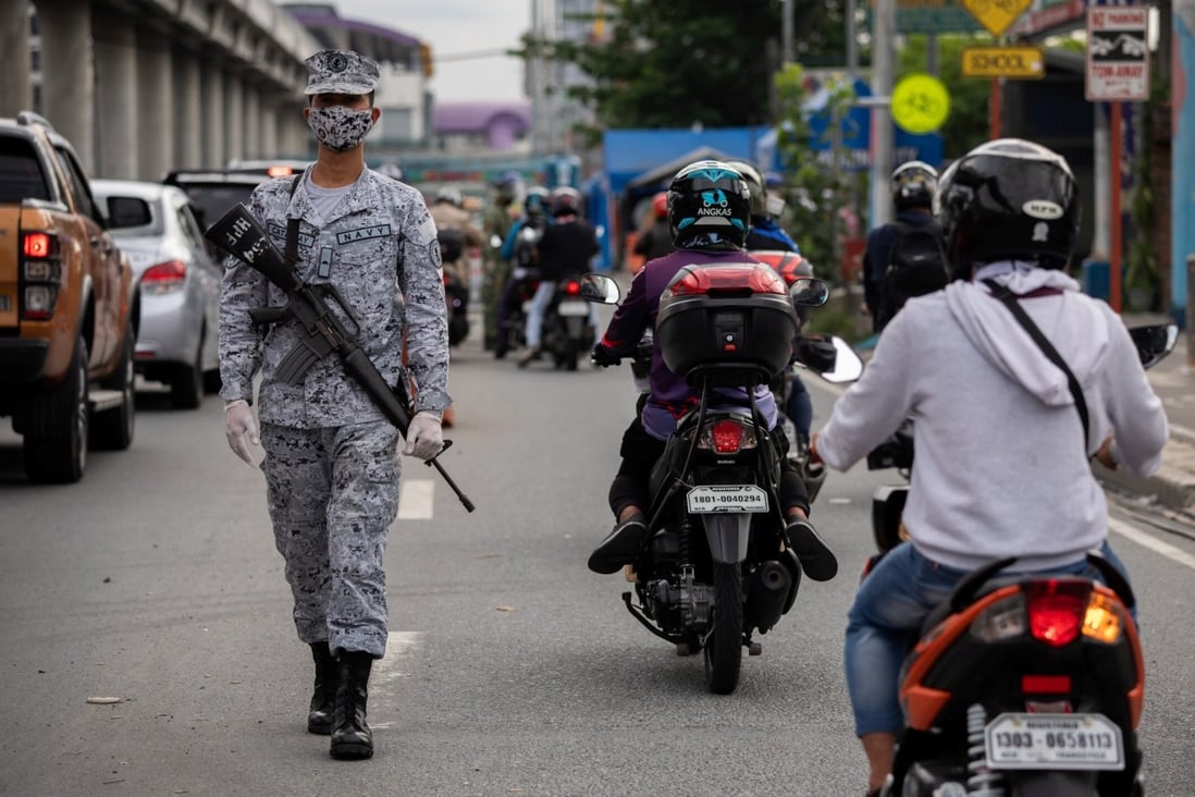 A soldier mans a quarantine checkpoint in Marikina City, Metro Manila. Photo: Reuters