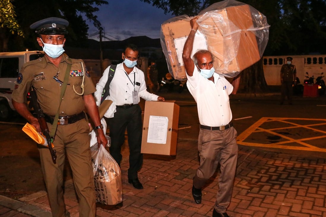 Election officials transport ballot boxes to the main counting centre amid legislative elections in Sri Lanka on Thursday. Photo: dpa