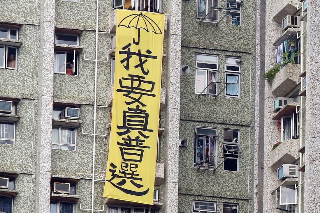 A banner saying: “I want universal suffrage”, hangs by the side of a block of flats in Tseung Kwan O in May 2016, during a visit to Hong Kong by a top mainland official. Photo: Nora Tam