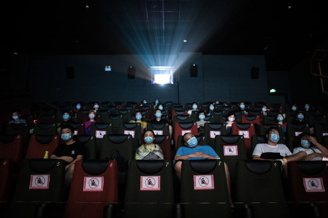 People watch a movie with masks on in a cinema in Wuhan, in China’s central Hubei Province, on July 20. Photo: Xinhua