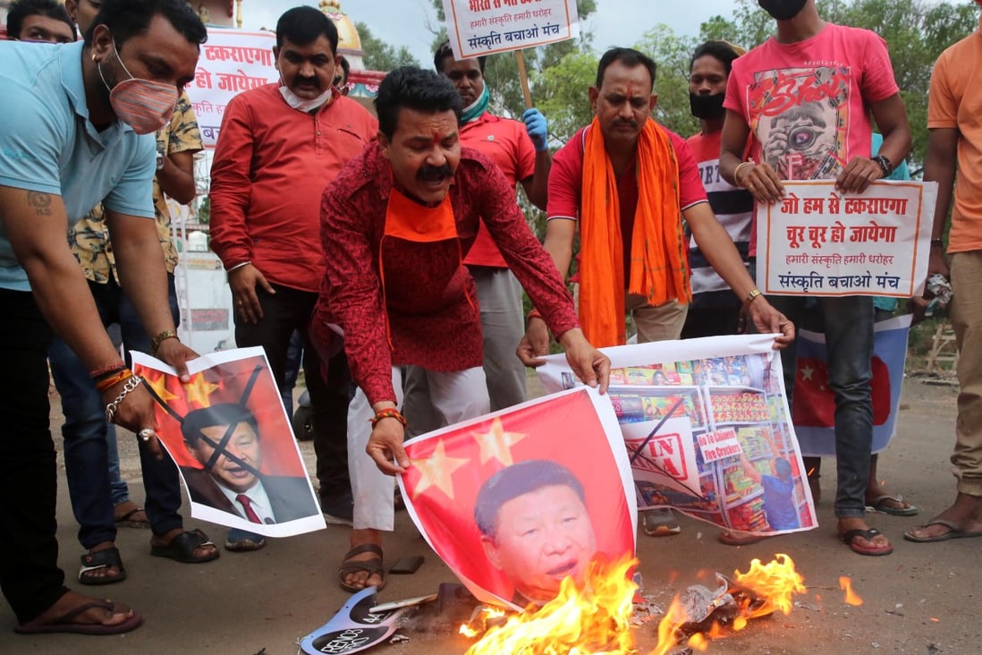 Activists of Sanskriti Bhchan Manch shout slogans as they stage a protest against China, holding posters of Chinese President Xi Jinping, in Bhopal, India, on June 16, 2020. Photo: EPA-EFE