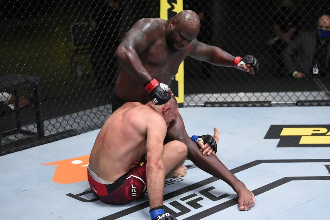 Derrick Lewis punches Aleksei Oleinik in their heavyweight fight during the UFC Fight Night event at UFC APEX in Las Vegas, Nevada. Photos: Chris Unger/Zuffa LLC