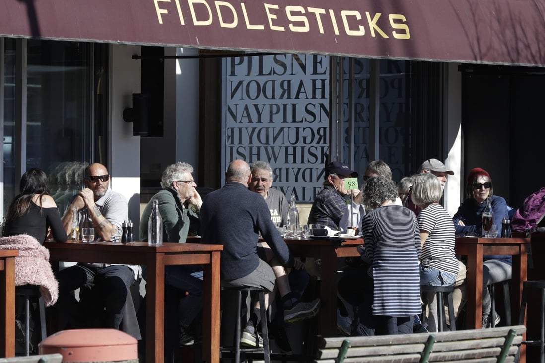 Customers at a cafe enjoy lunch in the sunshine in Christchurch, New Zealand. New Zealand marked a 100 days of being free from the coronavirus in its communities. Photo: AP