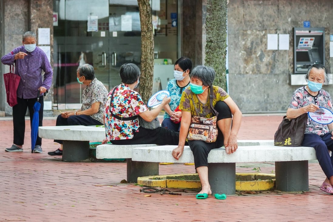 Elderly residents sit outside at Kai Yip Estate in Kowloon Bay. Photo: Sam Tsang