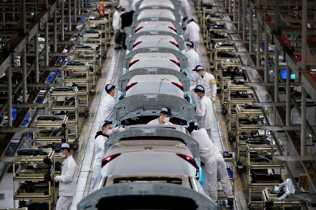 Employees work on a production line inside a Dongfeng Honda factory in Wuhan, Hubei province, on April 8. China’s swift return to positive economic growth is a rare bright spot amid a landscape of doom and gloom as the pandemic continues. Photo: Reuters