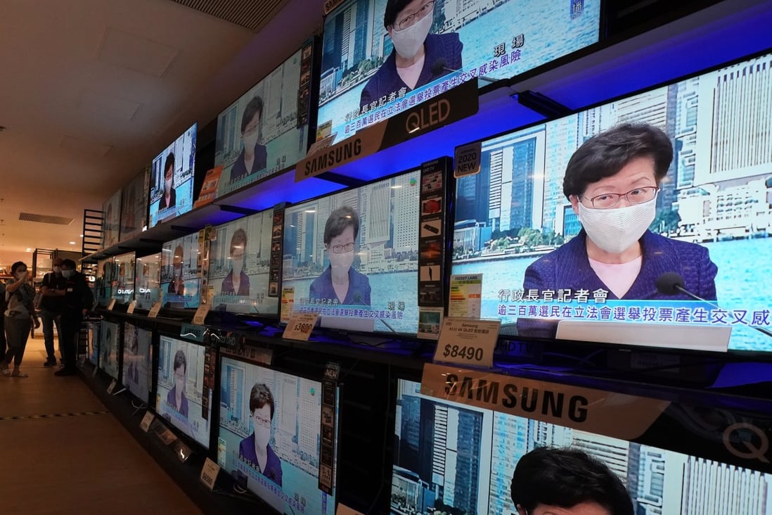 Multiple screens show Hong Kong Chief Executive Carrie Lam Cheng Yuet-ngor announcing the postponement of the city’s Legislative Council elections. Photo: Felix Wong