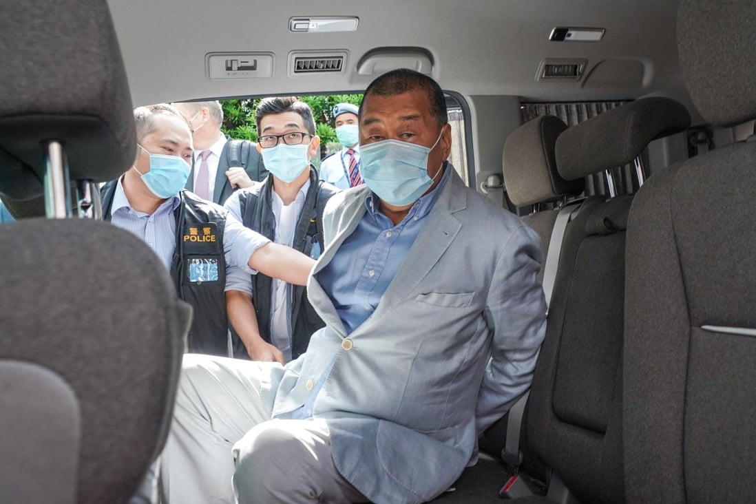 Hong Kong media mogul Jimmy Lai Chee-ying was arrested and brought out by police from his flat early on Monday on suspicion of breaching national security law. Photo: SCMP / Felix Wong