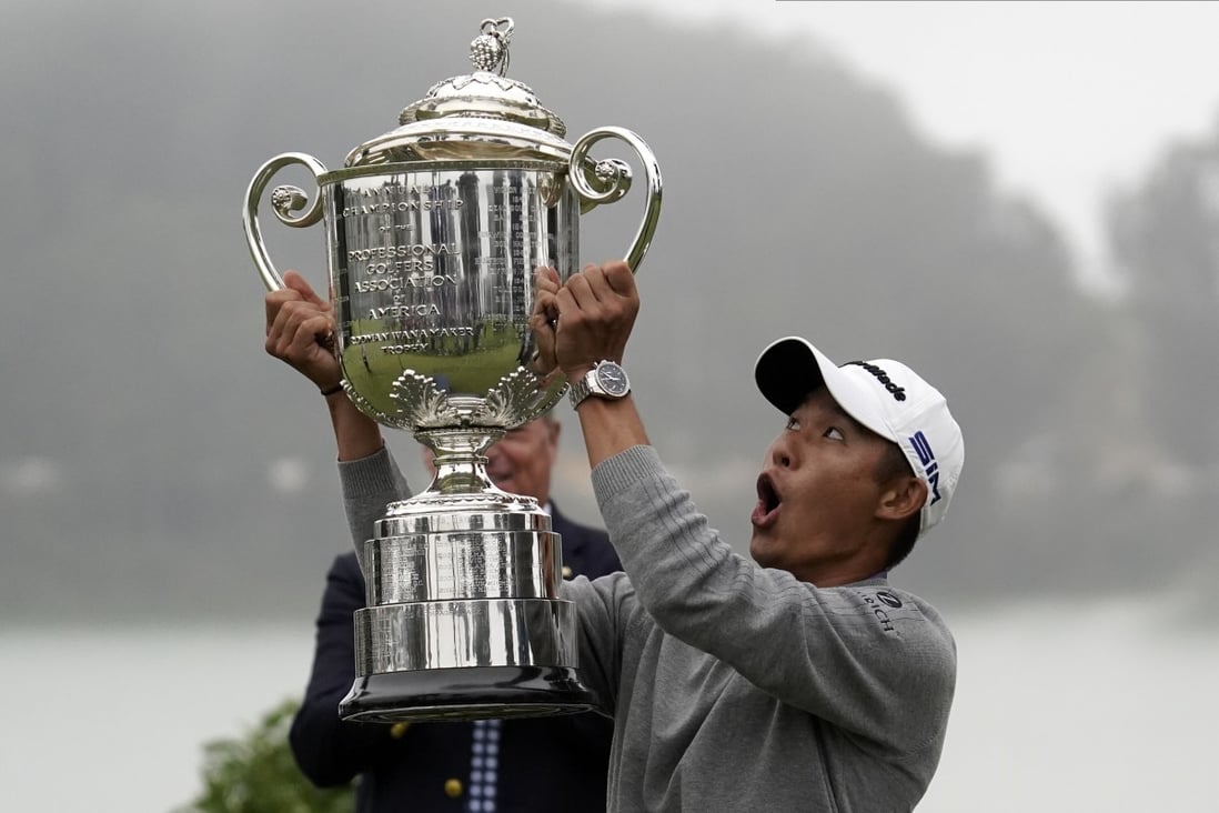 Collin Morikawa reacts as the top of the Wanamaker Trophy falls after winning the PGA Championship. Photo: AP