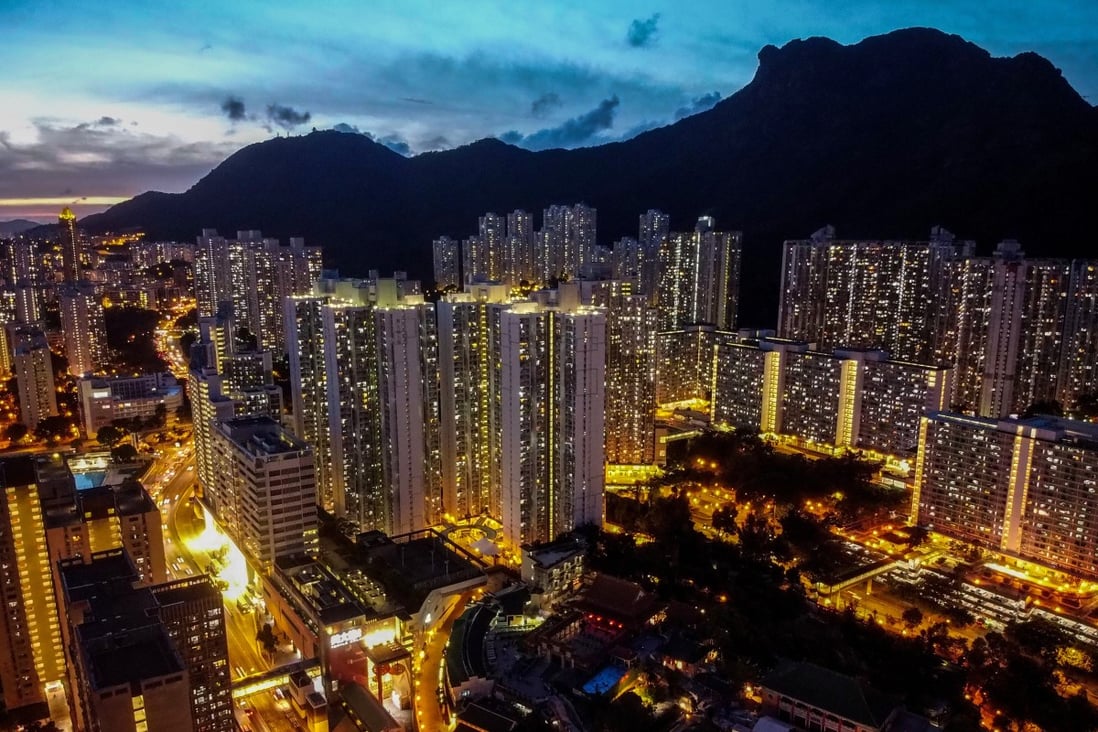 Residential buildings in Wong Tai Sin are flanked by the iconic Lion Rock mountain on July 17. Hong Kong has long topped rankings of the most expensive housing in the world. Photo: Sun Yeung