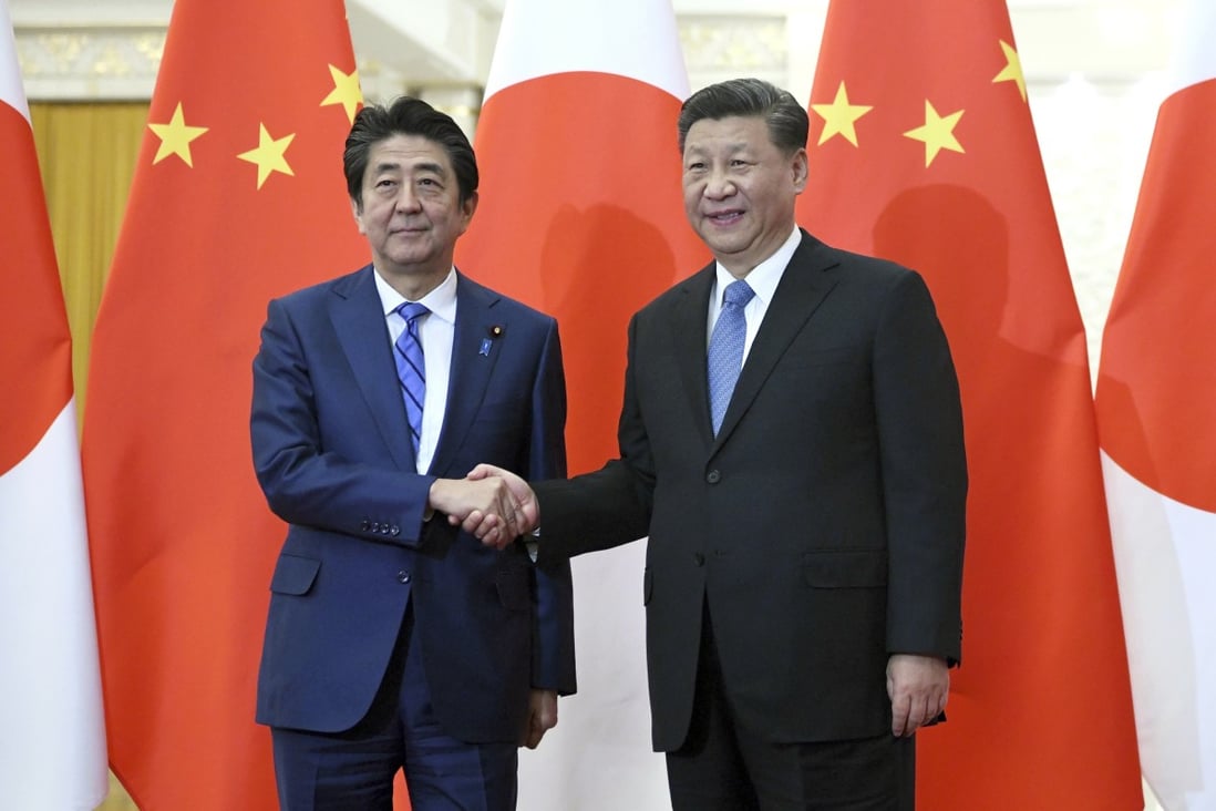 Japan's Prime Minister Shinzo Abe shakes hand with China's President Xi Jinping in 2019. Japan’s strained relations with China may lead it to enhance engagement and cooperation with Asean members. Photo: AP