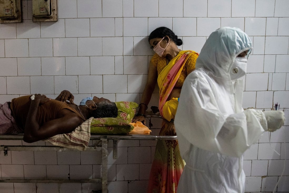 A woman leans against a stretcher holding her husband in the corridor of the emergency ward of Jawahar Lal Nehru Medical College and Hospital, in India’s eastern Bhagalpur city, as the country battles a worsening coronavirus disease (Covid-19) outbreak, on July 27. Photo: Reuters