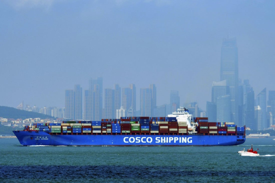 A China Cosco Shipping container ship sails past the skyline of Qingdao in eastern Shandong province on July 28. China’s transformation into an economic power is premised on its integration into global trade networks. Photo: AP