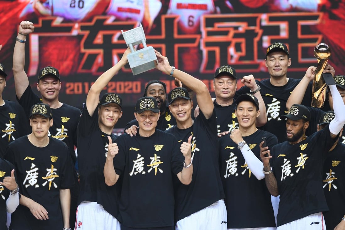 The Guangdong Southern Tigers celebrate with the CBA finals trophy after beating the Liaoning Flying Leopards for the 2019-2020 Chinese Basketball Association finals. Photo: Xinhua