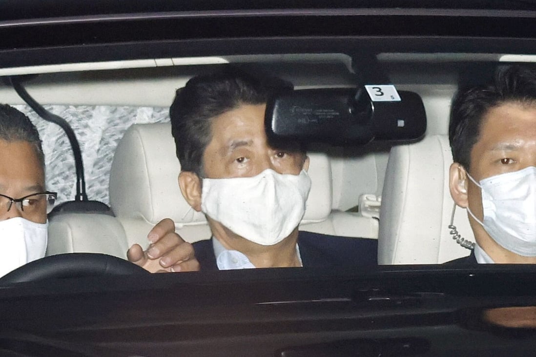 Japanese Prime Minister Shinzo Abe, centre, leaves Keio University Hospital in Tokyo on Monday amid speculation about his health. Photo: Kyodo