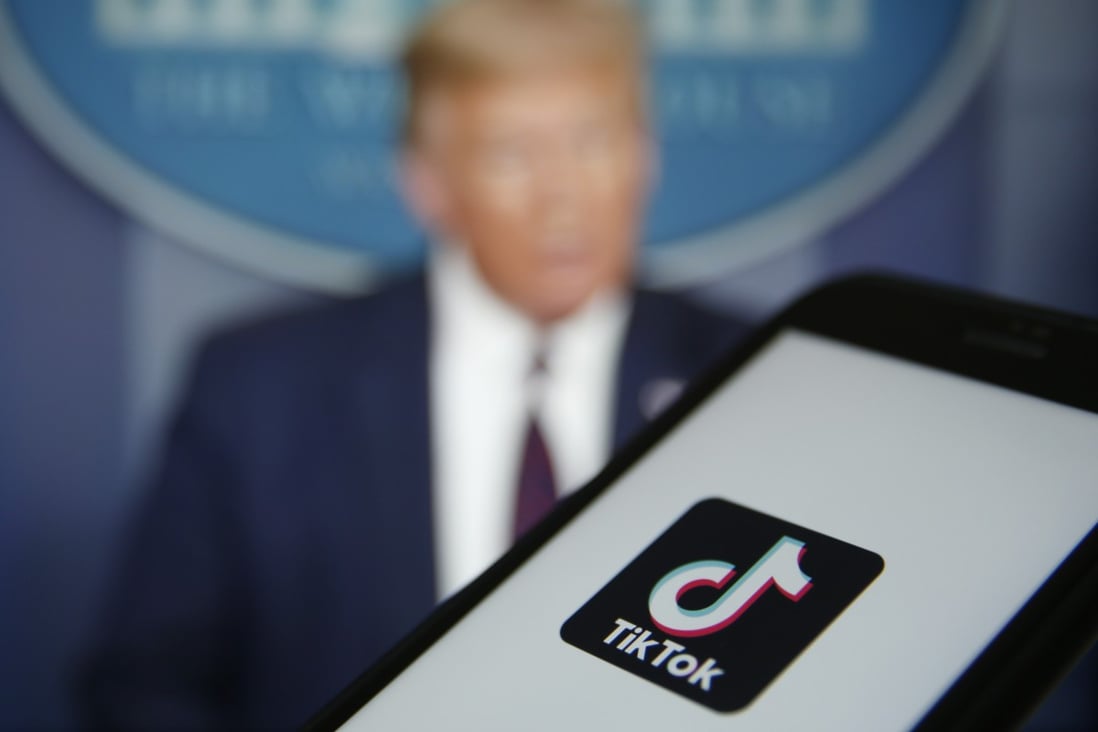 The TikTok logo is displayed in the app store in this arranged photograph in view of a video feed of US President Donald Trump in London, UK, on Aug. 3, 2020. Photo: Bloomberg