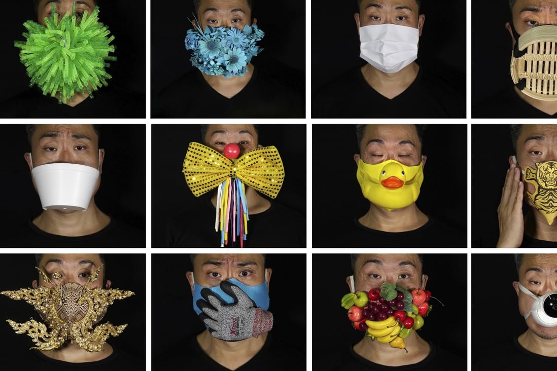 Edmond Kok wears a selection of his face masks with designs reflecting the coronavirus pandemic and Hong Kong politics. Photo: AP