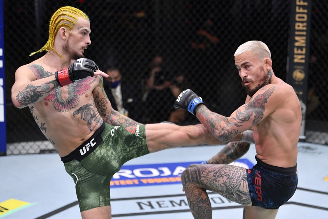 Sean O’Malley kicks Marlon Vera in their bantamweight bout during UFC 252. Photos: Jeff Bottari/Zuffa LLC