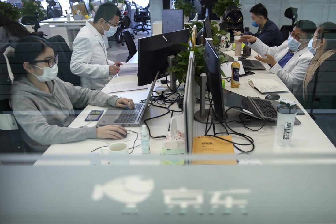 JD Health doctors consult patients online at the firm’s offices inside parent JD.com’s headquarters in Beijing. Photo: AP