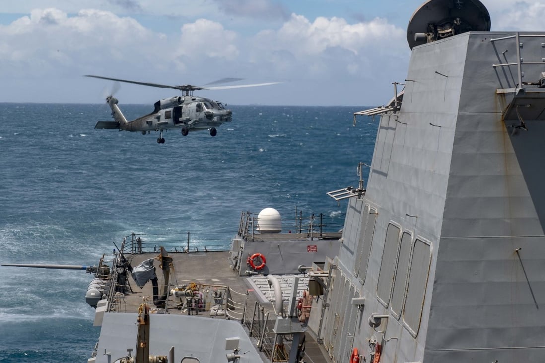 An MH-60R helicopter takes off from the flight deck of the USS Mustin during routine operations. Photo: US Navy