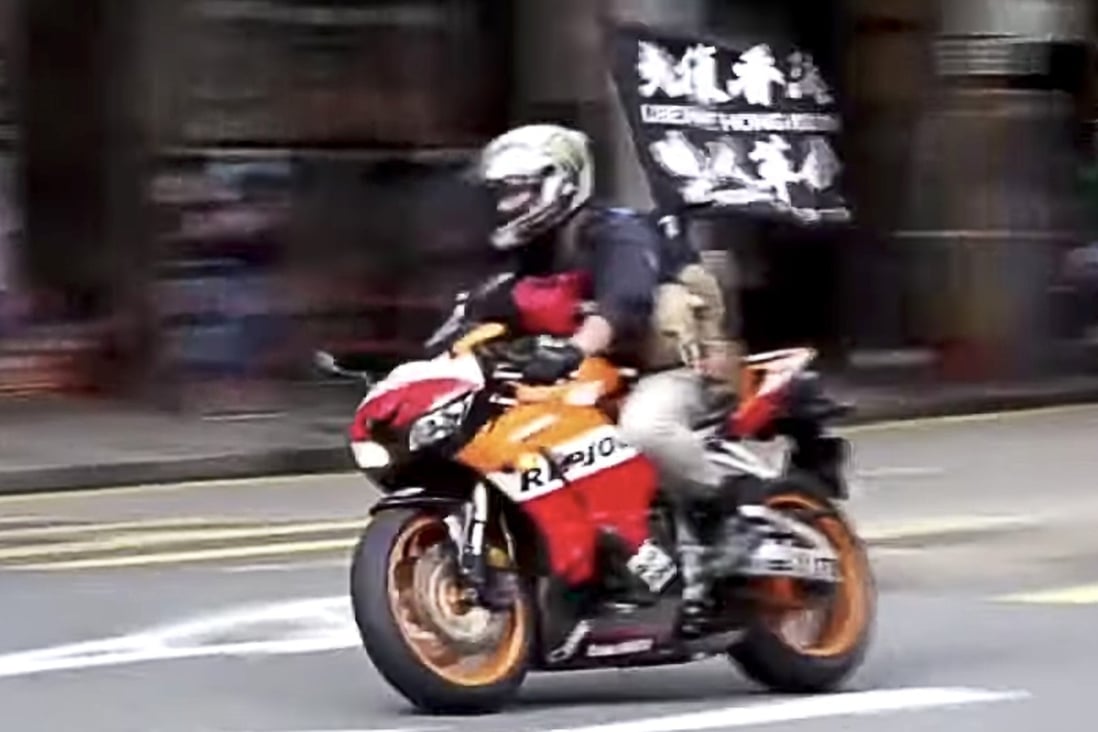 Tong Ying-kit, 23, who is accused of driving his motorcycle into a group of police officers at a July 1 protest, saw his bid for a writ of habeas corpus heard in court on Thursday. Photo: Cable TV