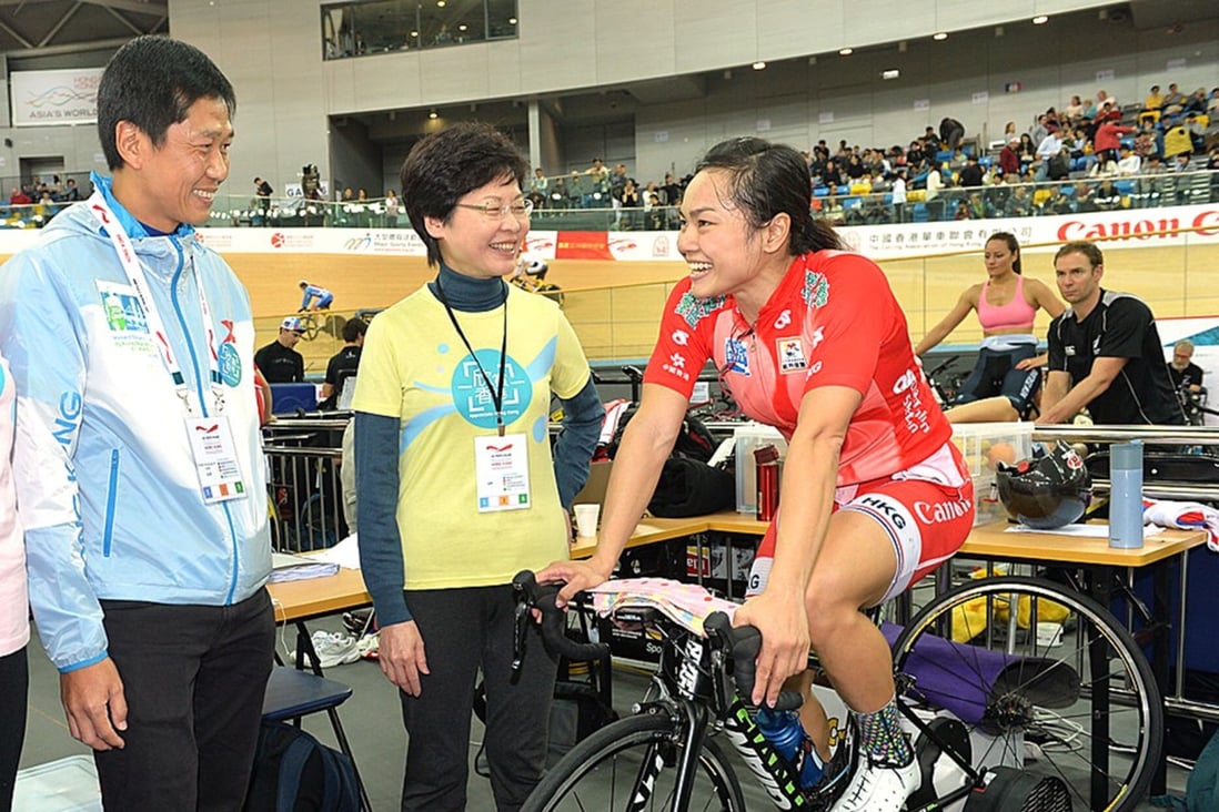 Chief executive Carrie Lam and Commissioner for Sports Yeung Tak-keung with star cyclist Sarah Lee Wai-sze. Photo: Handout