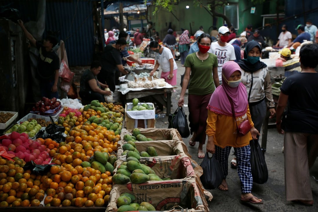 People shop at a market in Jakarta. Indonesia’s informal sector makes up between 60 and 70 per cent of the economy, and is where the country’s most vulnerable make their living. Photo: Reuters