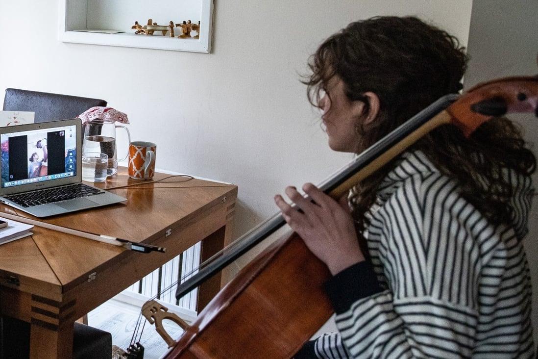 A cello student in Istanbul, Turkey, receives a remote lesson from her teacher. Photo: Getty Images