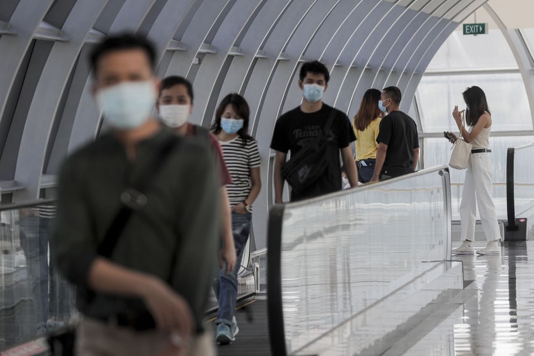 Passengers on a travelator at Changi Airport in Singapore. Photo: EPA