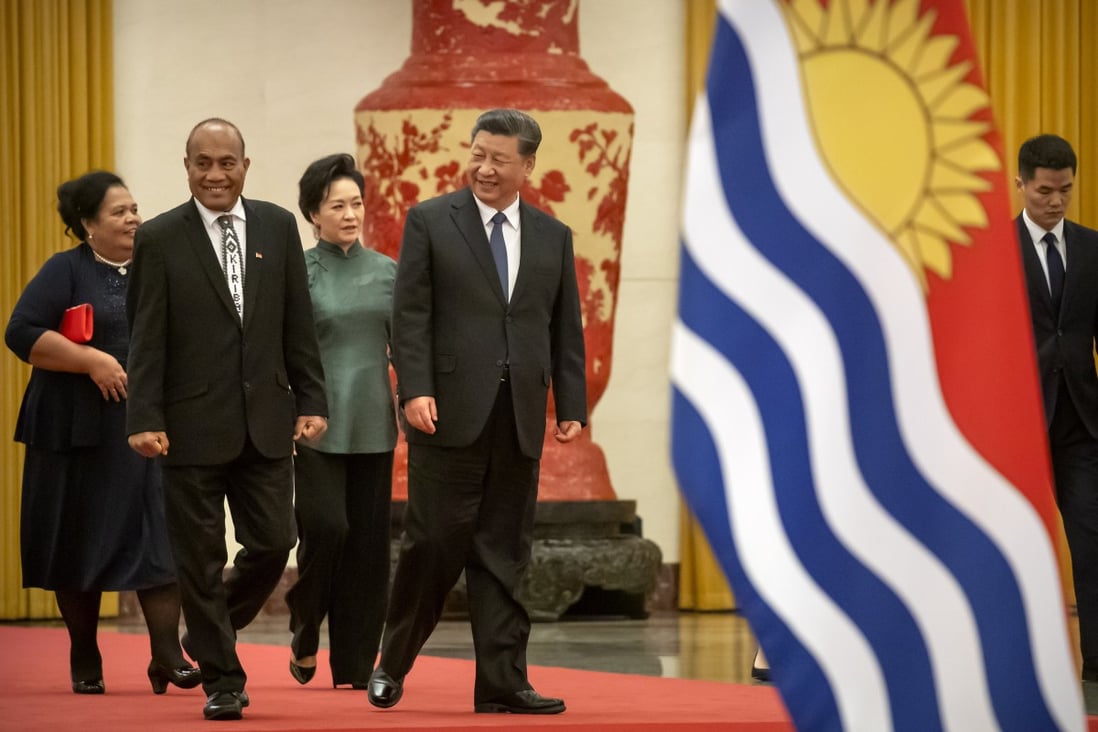 Kiribati's President Taneti Maamau, left, and Chinese President Xi Jinping walk together during a welcome ceremony at Beijing’s Great Hall of the People in January. Photo: AP