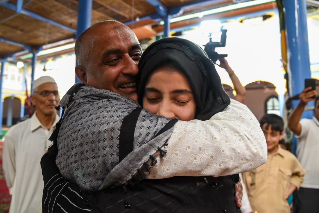 Mohammed Ali Bhat hugs a relative after his release from prison in 2019. Photo: Getty Images