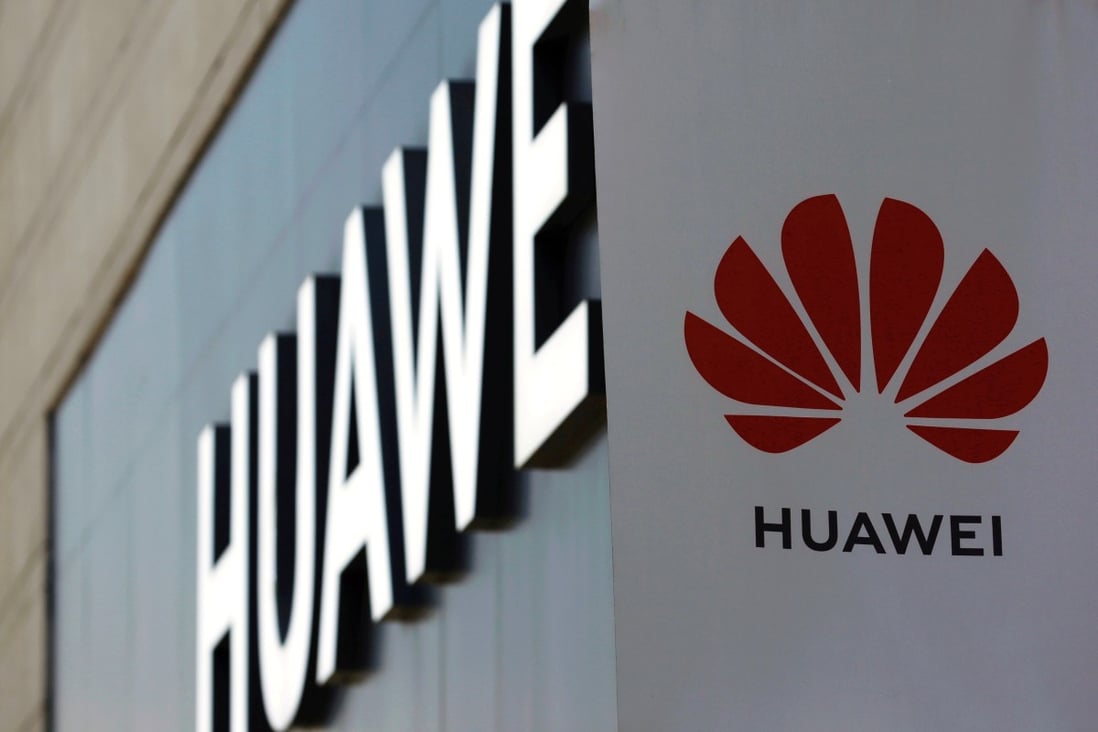 FILE PHOTO: A Huawei sign is seen outside its store at a shopping complex in Beijing, China July 14, 2020. REUTERS/Tingshu Wang/File Photo