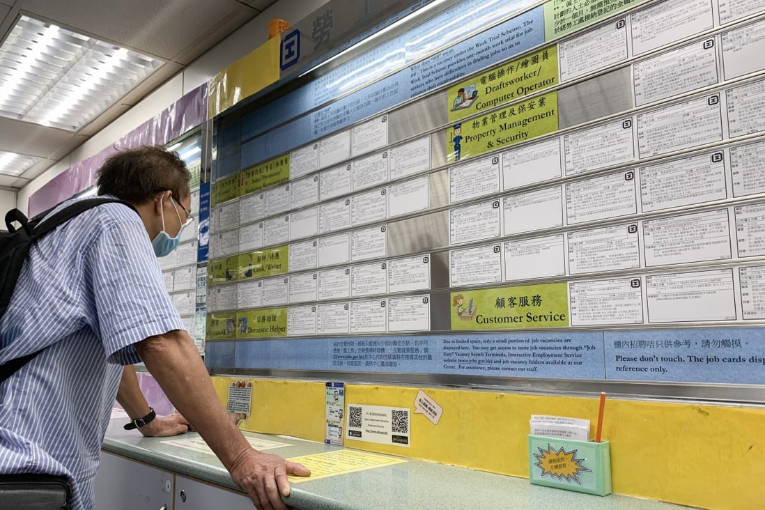 A man looks at job postings at the Employment Services branch of the Labour Department in May. Photo: Dickson Lee