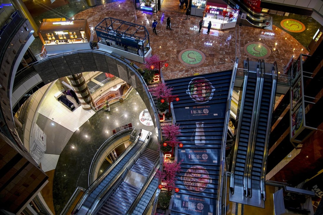 A few people are seen in a shopping mall in the Lujiazui financial district in Shanghai on February 5. Footfall at high-end shopping centres in Chengdu, Guangzhou and Shanghai had returned to, or exceeded, pre-pandemic levels by June, according to a study. Photo: Reuters