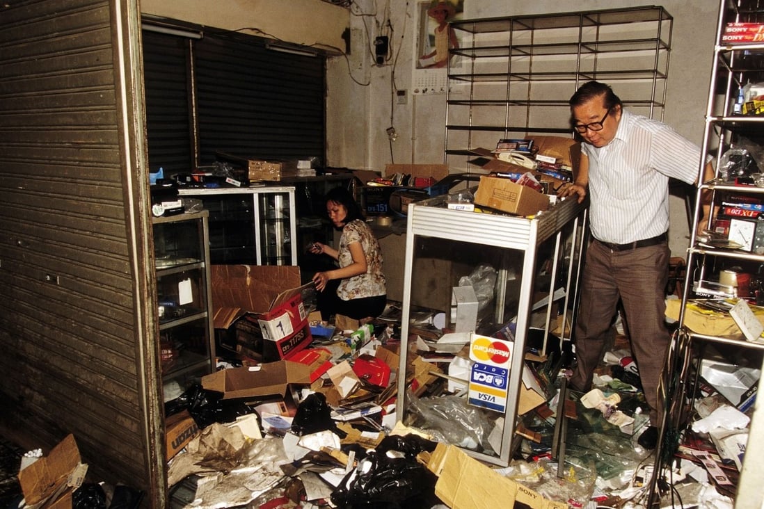 An ethnic Chinese shop owner inspects the damage to his shop after a spate of looting in Jakarta, Indonesia in 1998. As Indonesia marks 75 years of independence this month, Chinese Indonesians are hoping to guide their country to a brighter future. Photo: Getty Images
