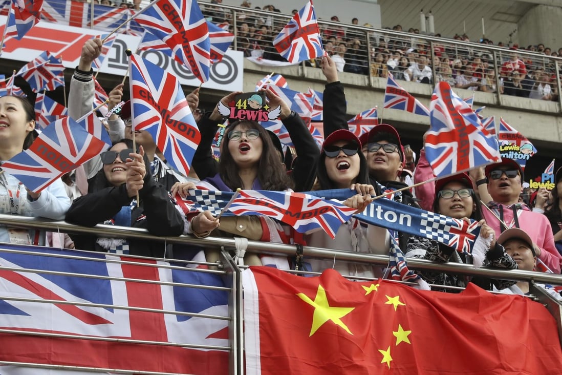 Fans of Mercedes driver Lewis Hamilton cheer during the qualifying session for the Chinese Formula One Grand Prix last year. Photo: AP
