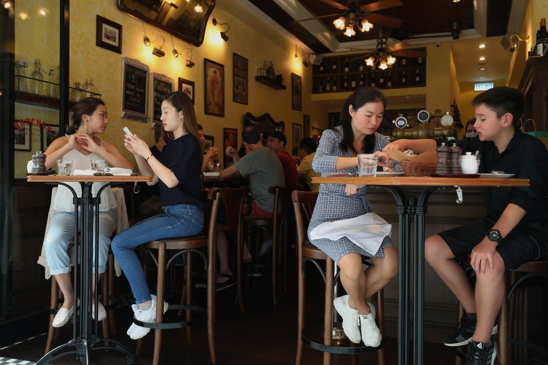 Customers having lunch at a restaurant in Hong Kong’s Central neighbourhood in May. Covid-19 health restrictions have become so tiresome for individuals that even a slight easing is welcome. Photo: Xiaomei Chen