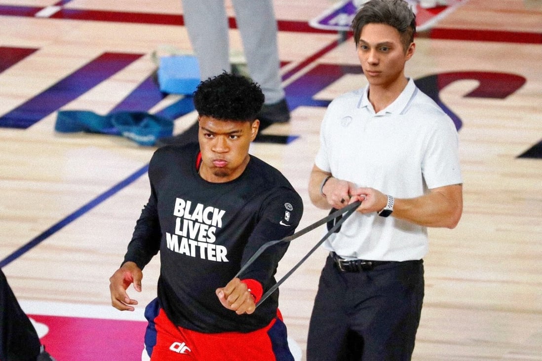 Japanese NBA star Rui Hachimura is assisted by 'virtual influencer' Liam Nikuro in the warm-up before a game in the 'bubble'. Photo: 1Sec