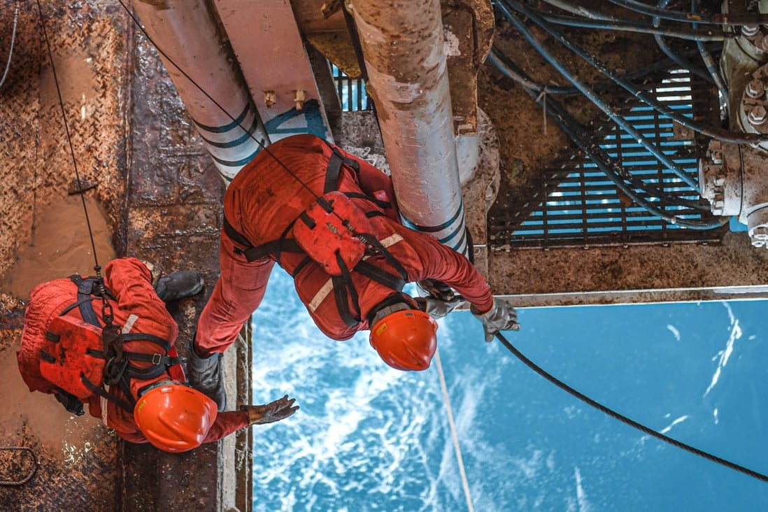 Workers balance on a Chinese offshore oil platform in the South China Sea on July 27. The South China Sea is one of China’s red lines. Photo: Xinhua