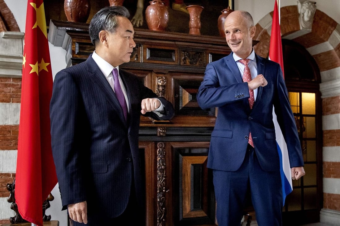 Dutch Minister of Foreign Affairs Stef Blok welcomes his Chinese counterpart Wang Yi at Duivenvoorde Castle in Voorschoten, the Netherlands, on Wednesday. Photo: AFP