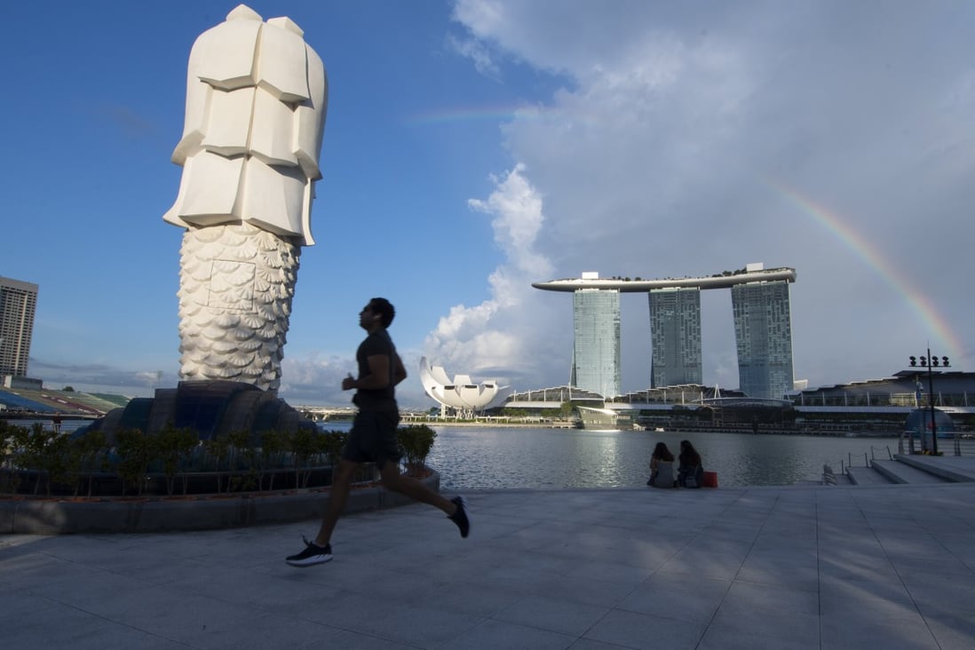 Uncertain job prospects, online commentary and stricter conditions risk making Singapore a less welcoming destination. Photo: Xinhua