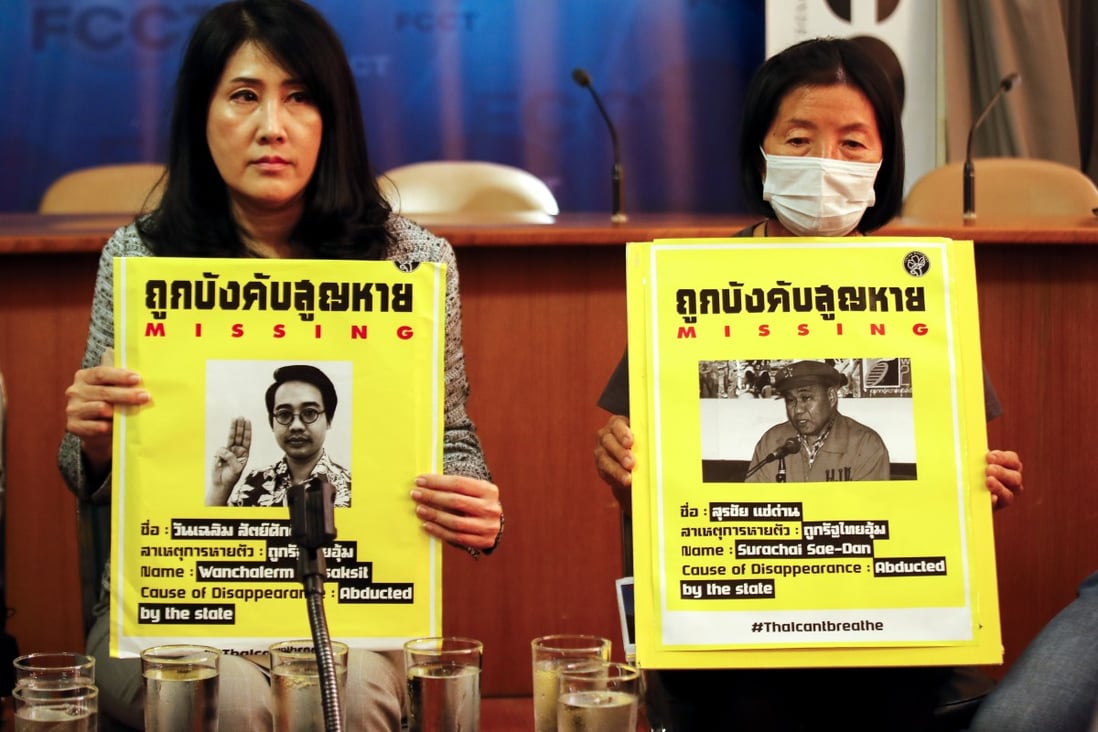Sitanun Satsaksit (L) holds a picture of her missing brother, next to Pranee Danwattananusorn, wife of missing activist Surachai Sae-Dan, during an event to commemorate the international day of victims of enforced disappearances. Photo: EPA-EFE